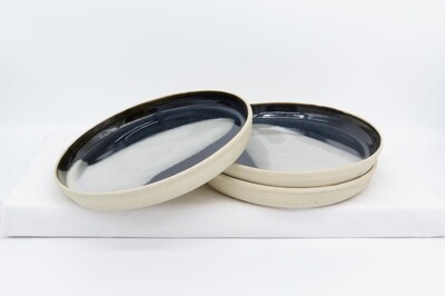 Side Plate - Black and mottled grey.