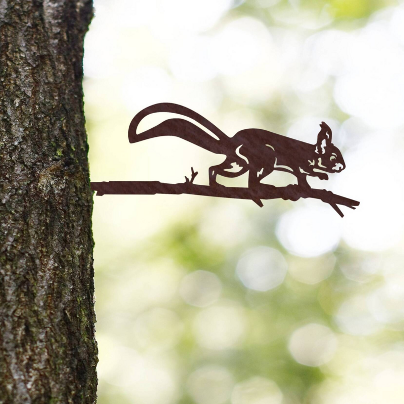 Squirrel on a branch of corten steel