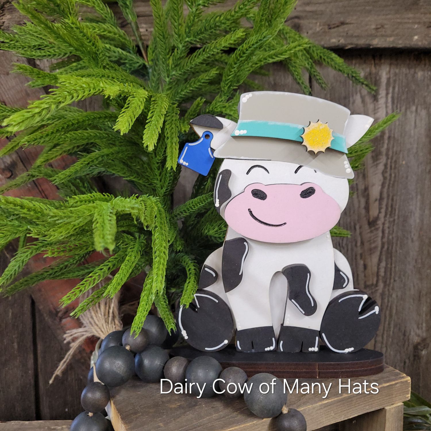 DAIRY COW OF MANY HATS