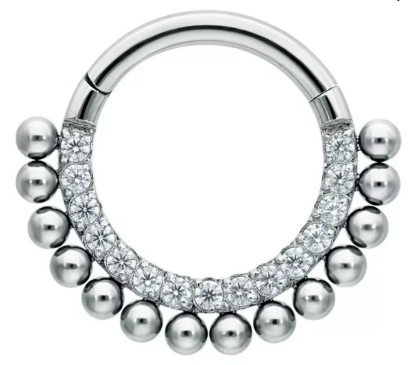 Segmentring/clicker bedekt met zirconia en balletjes Titanium