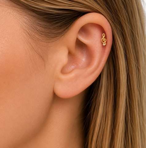 Labret/helix/tragus piercing in goud titanium solsleutel