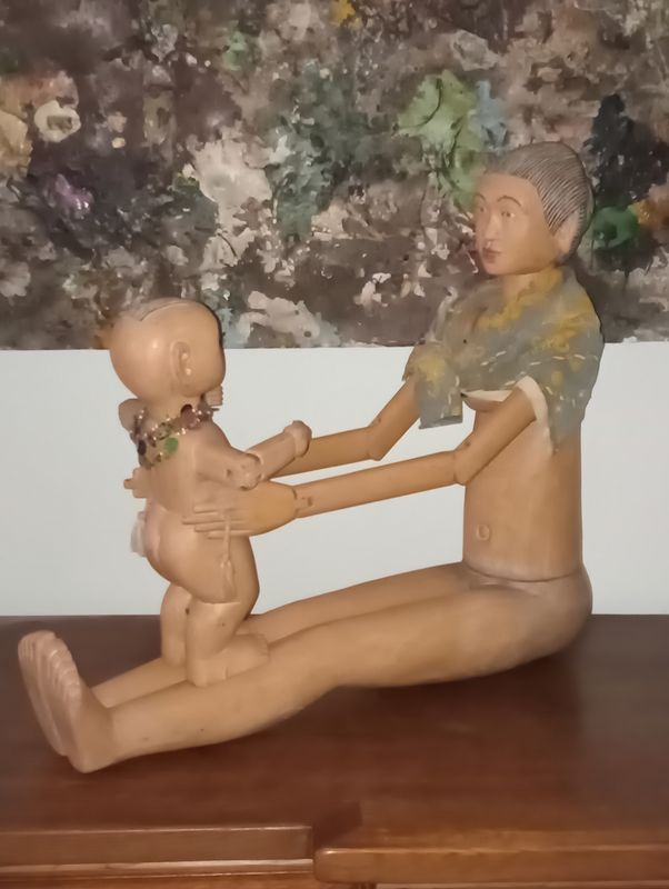 Mother and baby carved from wood with accessories Mother and baby carved from wood with accessories