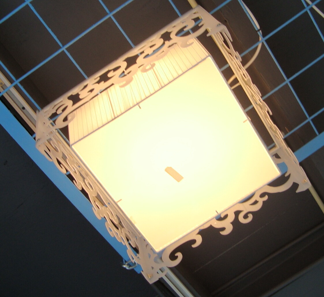 LIGHT SIMILAR TO  PHOTO BUT NOT SQUARE. ROUND SHAPE