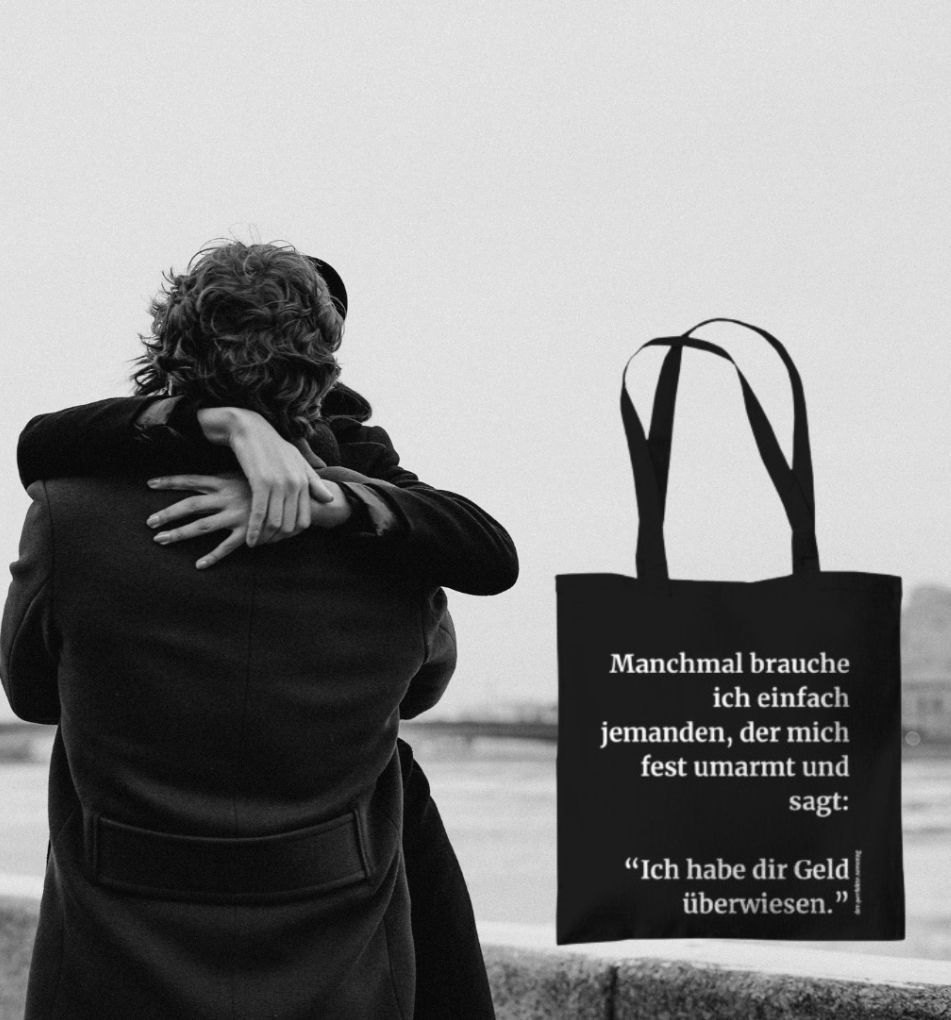 Baumwoll-Beutel in schwarz mit lustigem Spruch. Manchmal brauche ich einfach jemanden, der mich fest umarmt und sagt: Ich habe dir Geld überwiesen.