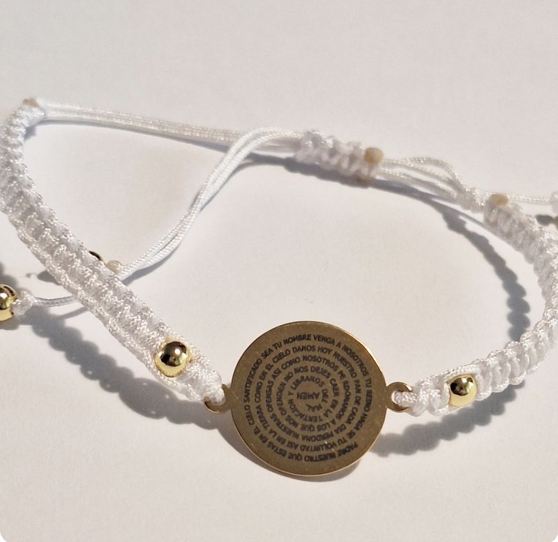 Pulsera Padre Nuestro Acero Bañado hilo de seda.
