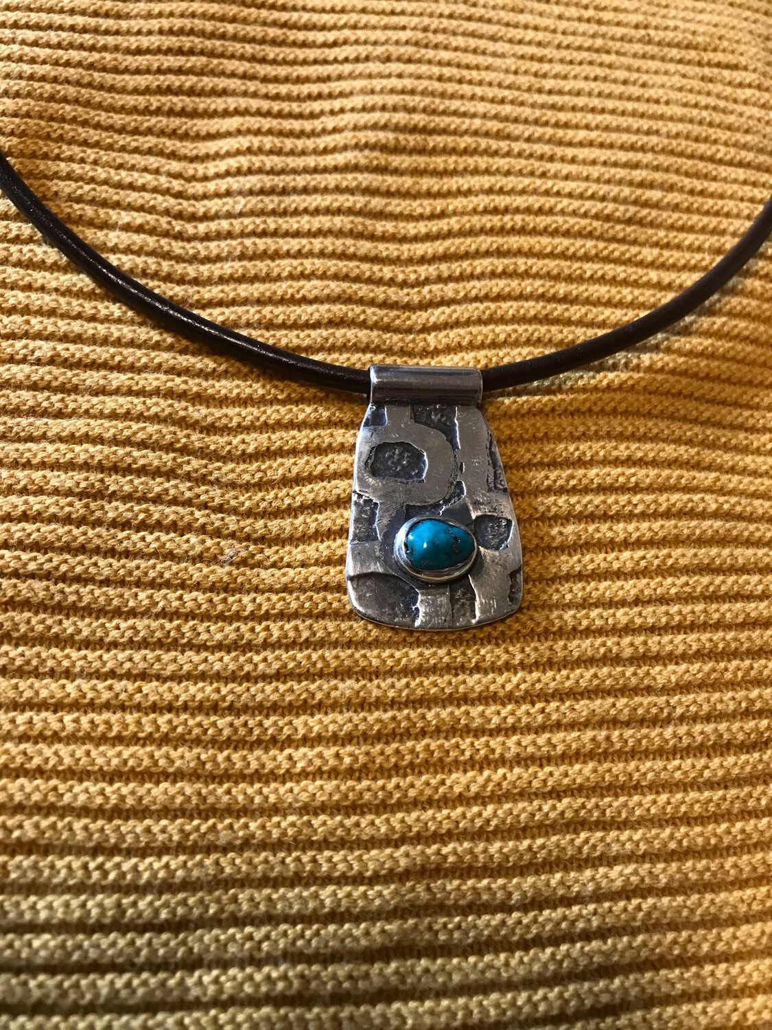 Turquoise Set in Etched Sterling Silver.