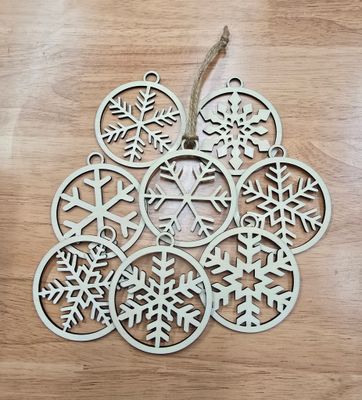 Pack of 8 assorted natural wood snowflake ornaments
