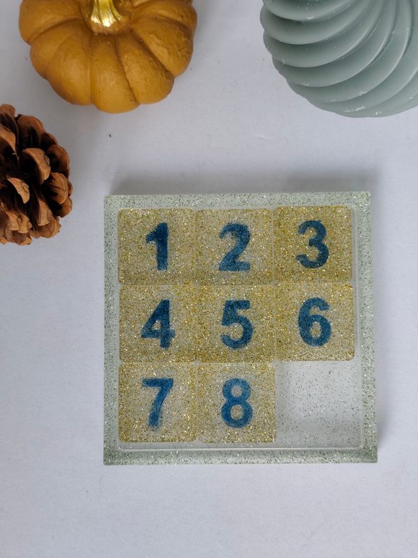 Jeu de taquin - fond argenté Jeu de taquin - fond argenté