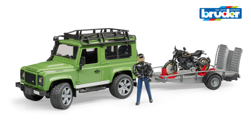 Land Rover Defender Station Wagon mit Anhänger, Motorrad und Figur Land Rover Defender Station Wagon mit Anhänger, Motorrad und Figur