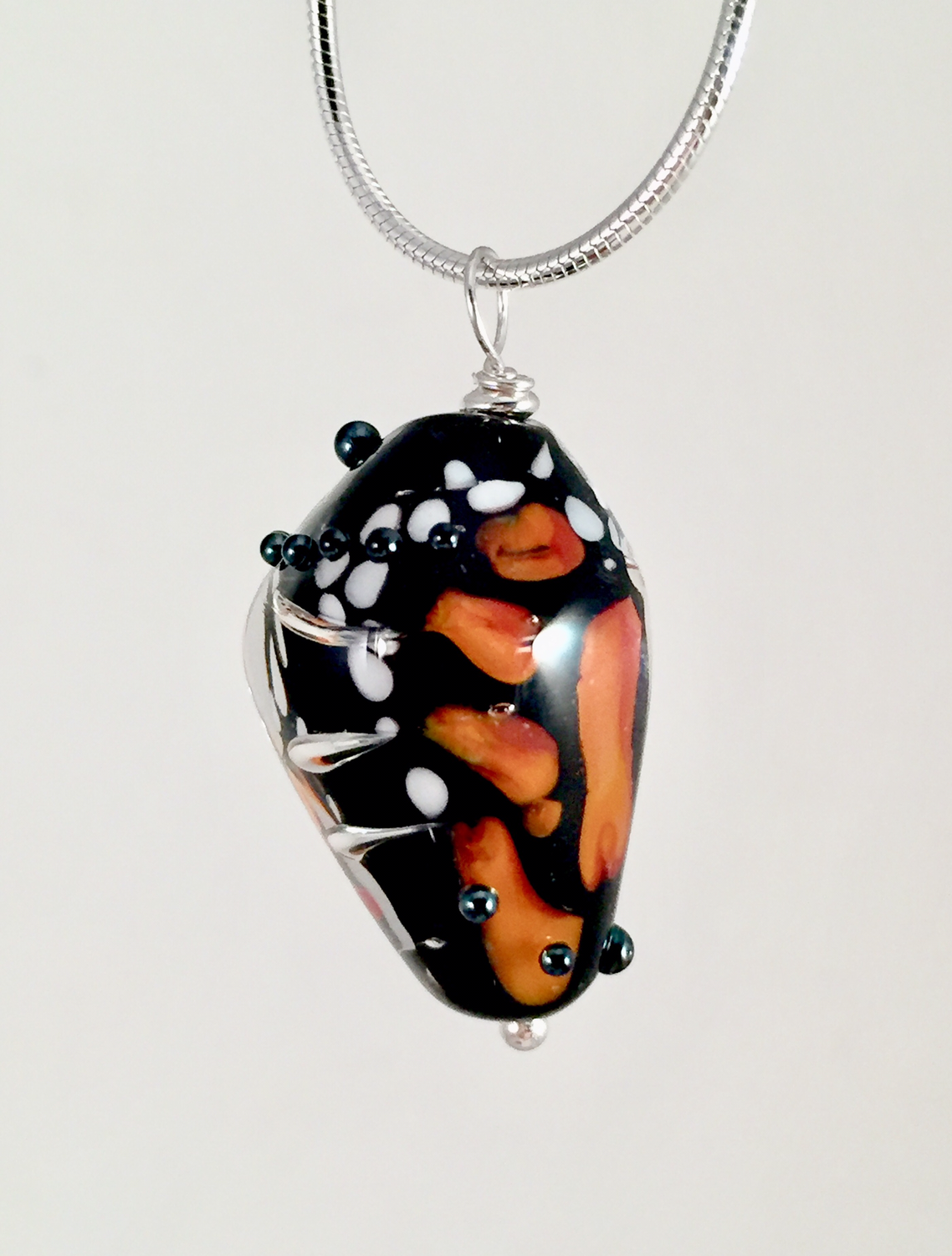 Monarch butterfly chrysalis pendant, late stage