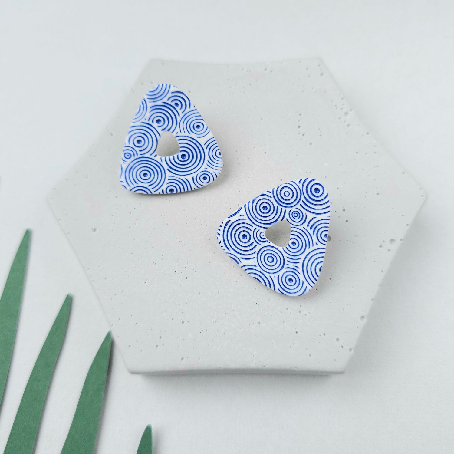 Blue and white triangle clay studs