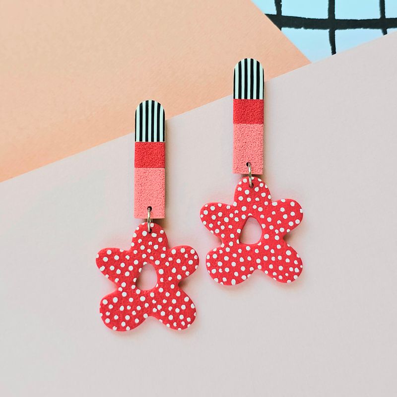 Long statement earrings with colourful upper bar and dotted red bottom flowers