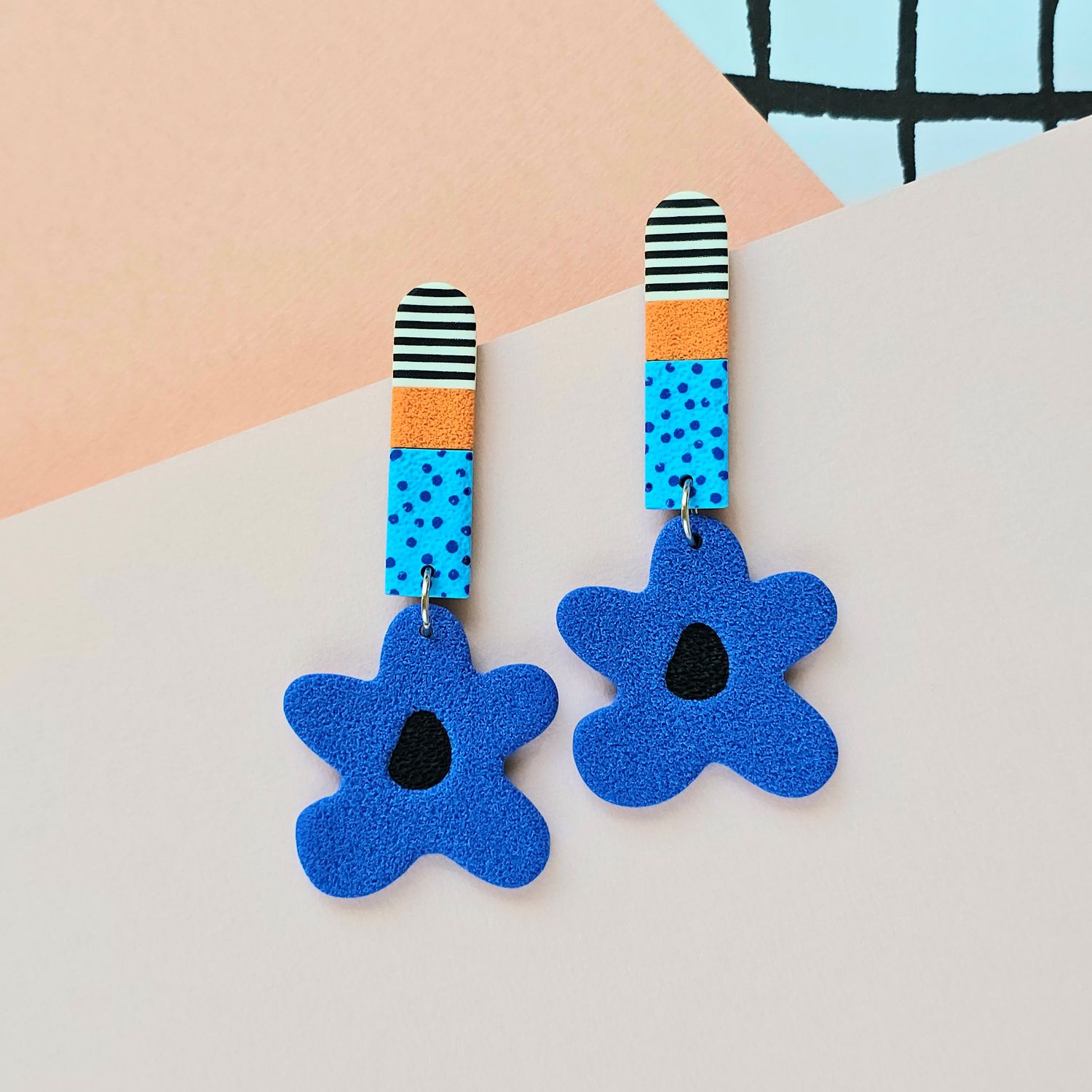 Long blue statement polymer clay earrings with blue flowers with black centres
