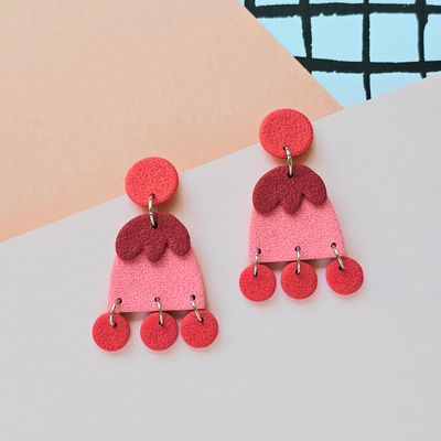 A pair of red, pink and dark red funky statement polymer clay earrings.