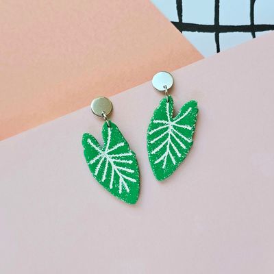 A pair of green leaves with white veins polymer clay earrings.