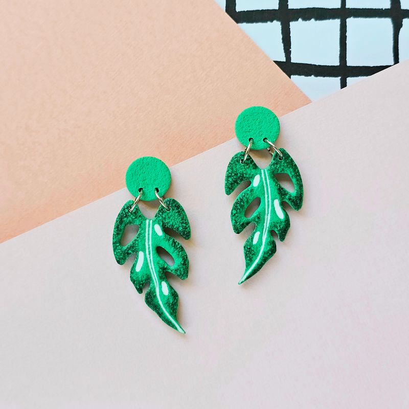 A pair of green tropical leaf polymer clay earrings