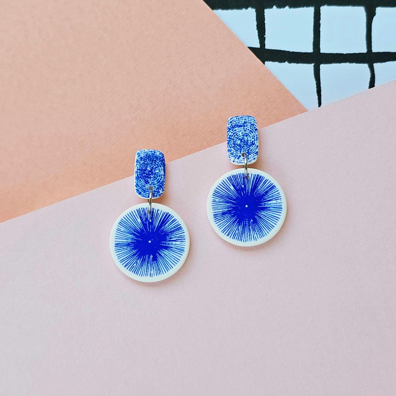 A pair of funky blue and white polymer clay earrings