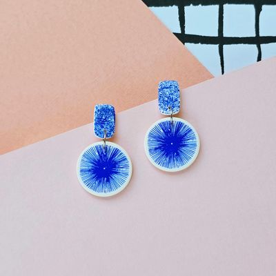 A pair of funky blue and white polymer clay earrings