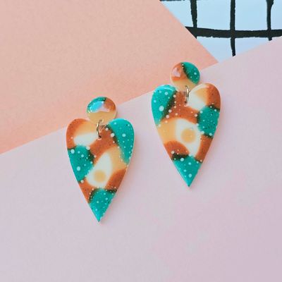 A pair of green, brown, beige heart resin earrings