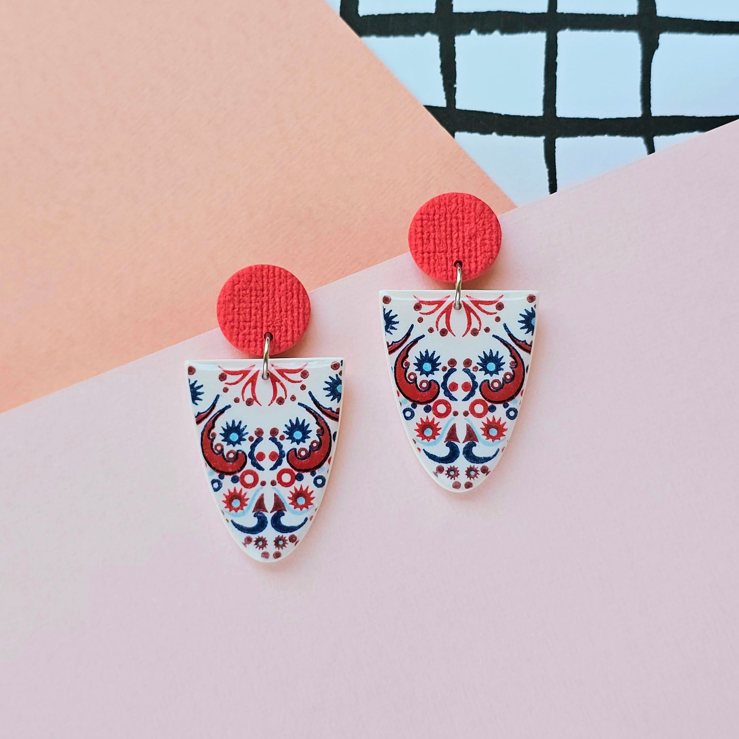 A pair of red, blue and white geoemtric earrings
