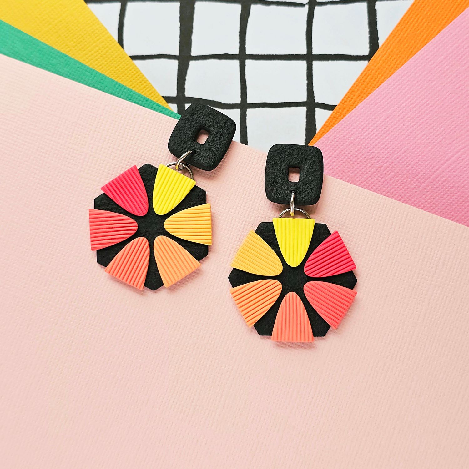 A pair of gradient orange to yellow statement earrings 