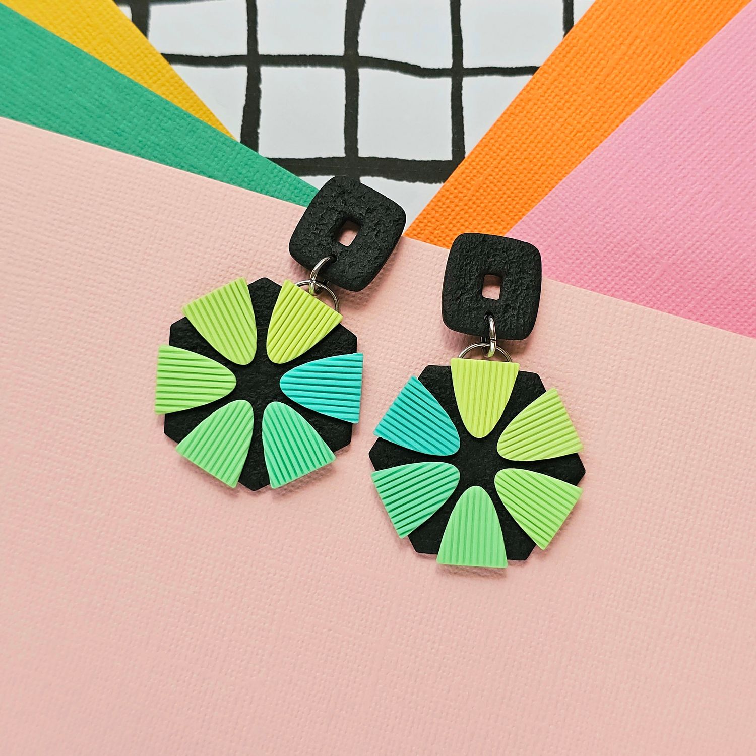 A pair of gradient green to blue statement earrings 