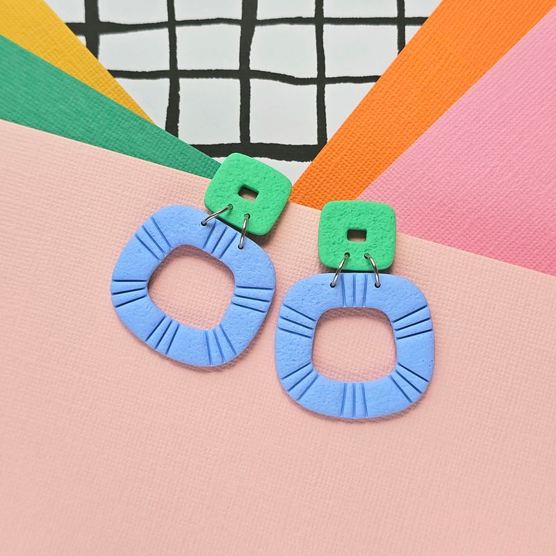 A pair of blue and green statement polymer clay earrings