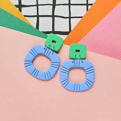 A pair of blue and green statement polymer clay earrings