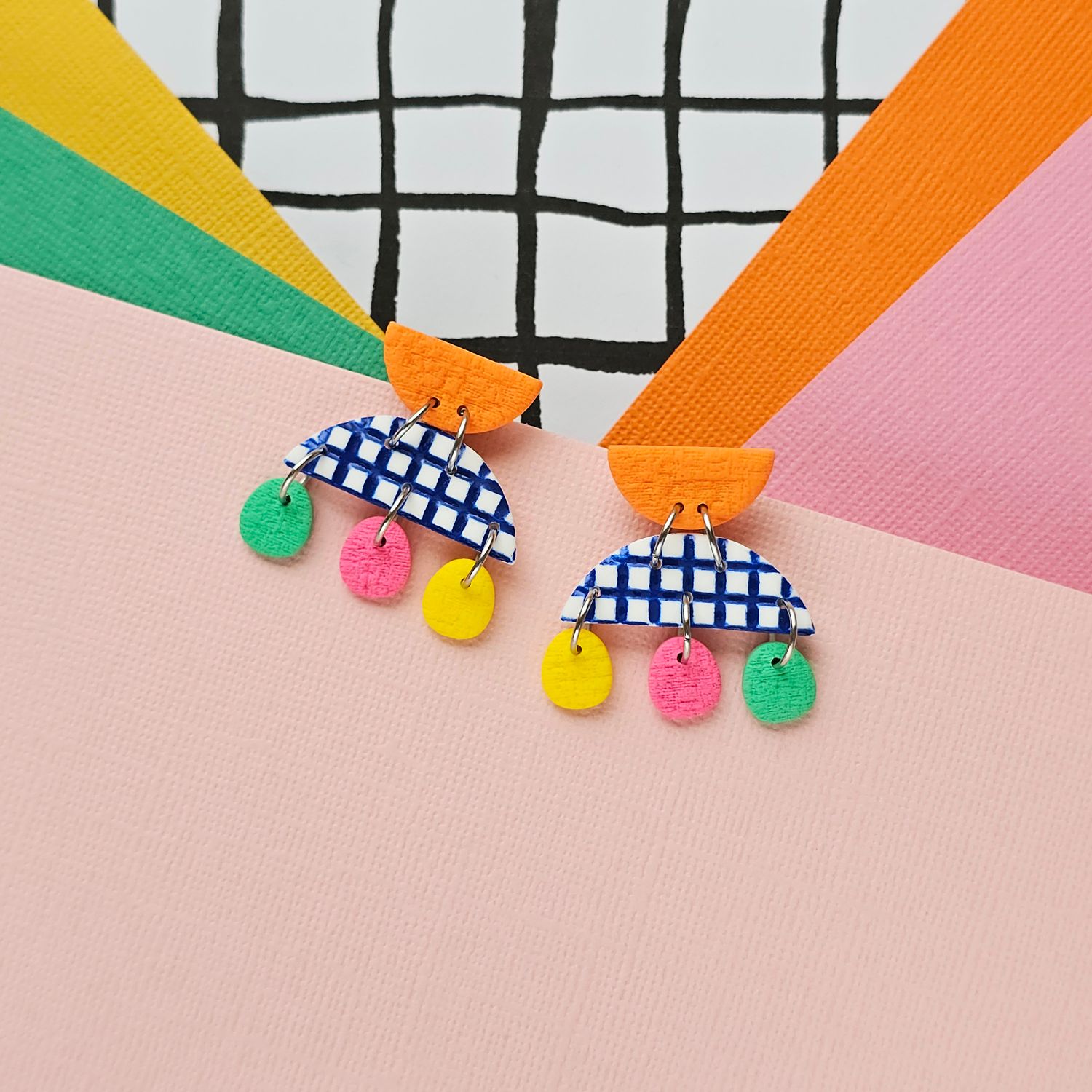 A pair of small colourful polymer clay earrings