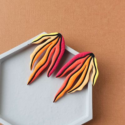 A pair of red, orange, yellow gradient leaf polymer clay long studs