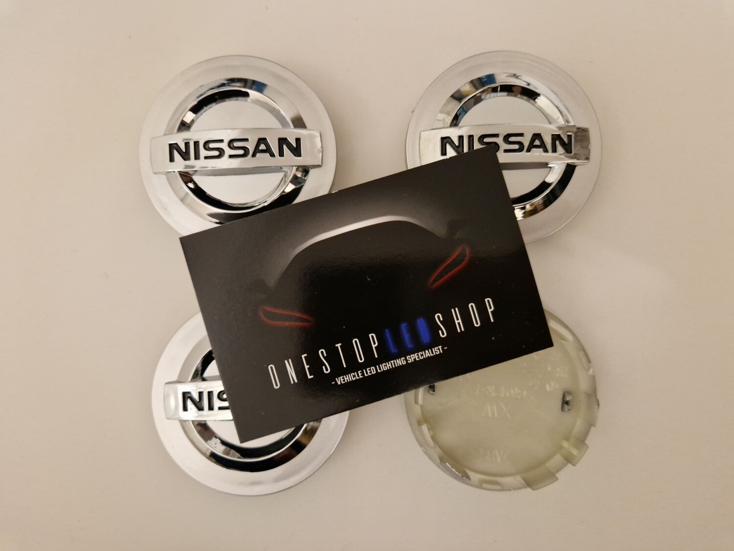 4 X Nissan silver 54mm Alloy wheel center hub caps