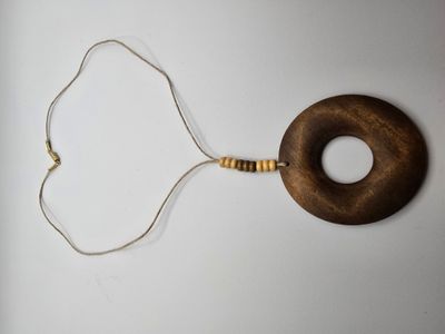 Stone Wheel Necklace – Wooden Circle Pendant on Cream Cord
