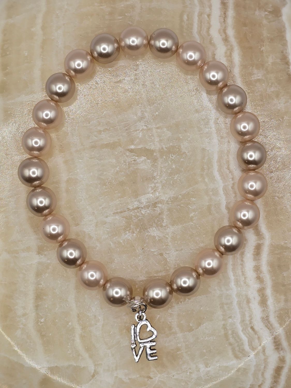“Pearl Affection” Bracelet – Classic Pearls with Love Charm