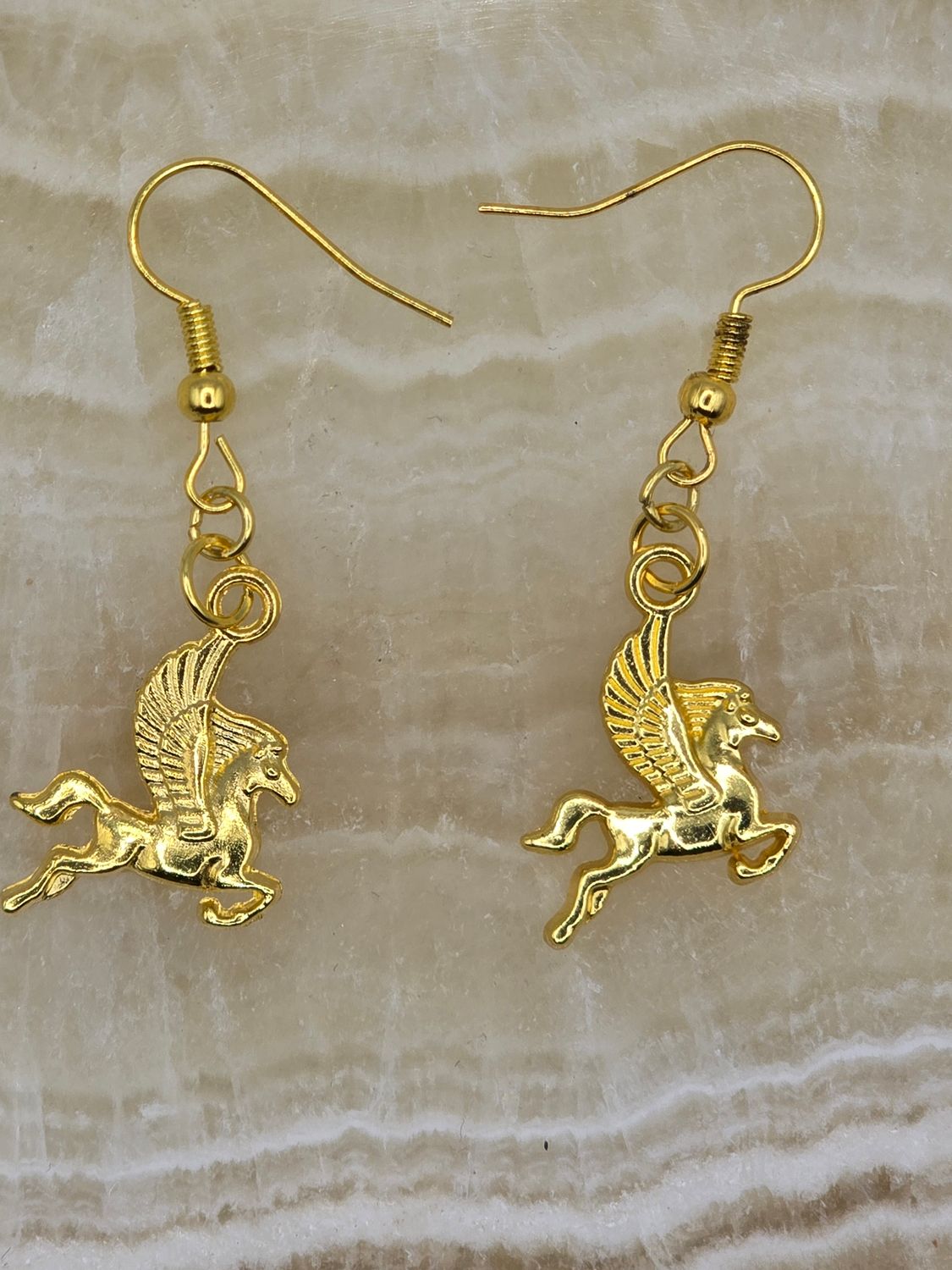 Skybound Steeds – Gold Pegasus Dangle Earrings