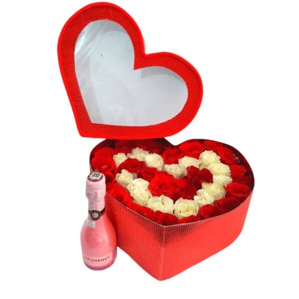 Arreglo floral en corazón con champagne