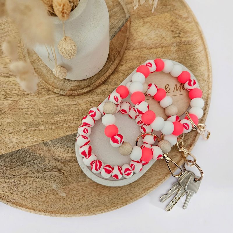 Schlüsselanhänger Armband Schlüsselanhänger Armband "Kiss"