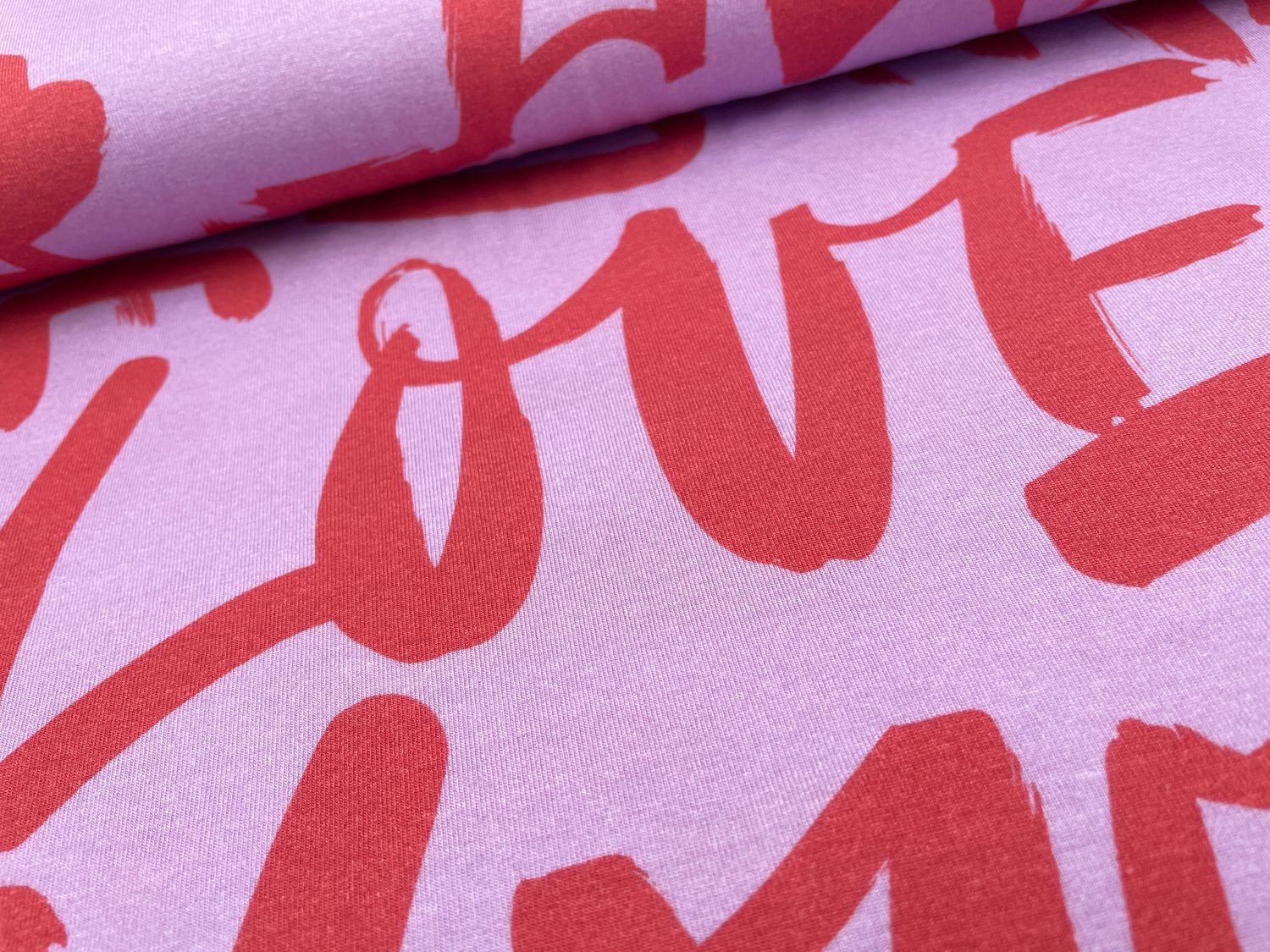 Tencel Jersey "Love" Flieder / Koralle
