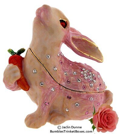 Pink Rabbit Holding Carrot