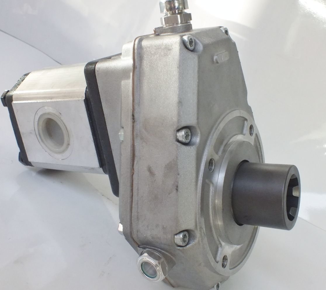 Aluminium Speed increase gearbox showing splined male tractor input Shaft at top right and gear pump mounted to speed increase output shaft at bottom left. 