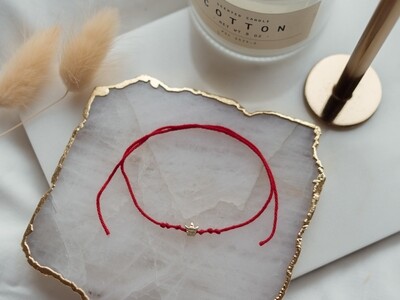 Red String with a Miniature Crown