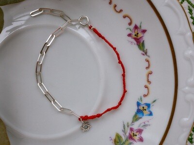 A silver bracelet with a Star of David charm