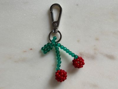 Bag charm with cherries
