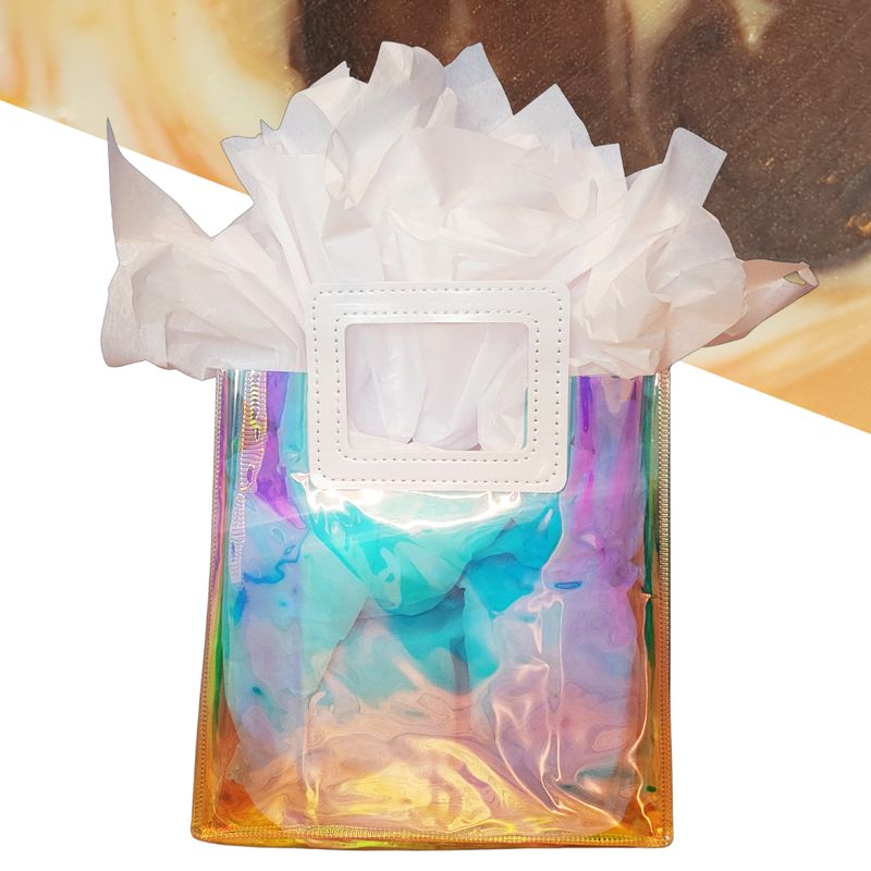iridescent gift bag with orange creamsicle soap in background
