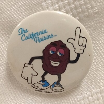 1 1/2"D California Raisin Justin X Grape Pinback Button