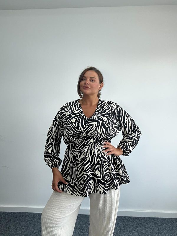 Long sleeved animal print wrap top