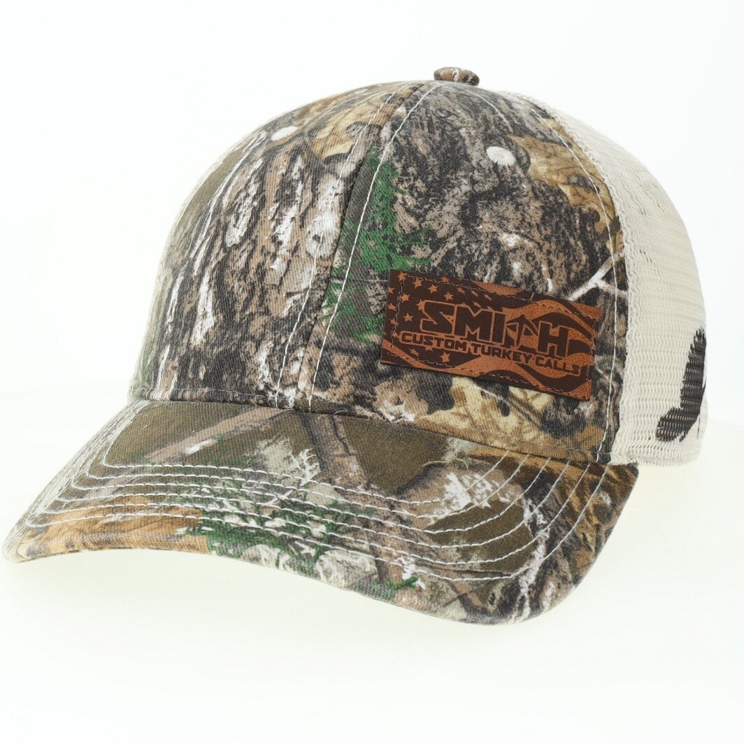 Legacy REALTREE Edge Trucker with leather patch and turkey on the side.