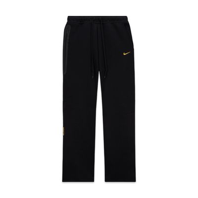 Nike NOCTA Tech Fleece Open-Hem Pants – Black / University Gold Nike NOCTA Tech Fleece Open-Hem Pants – Black / University Gold
