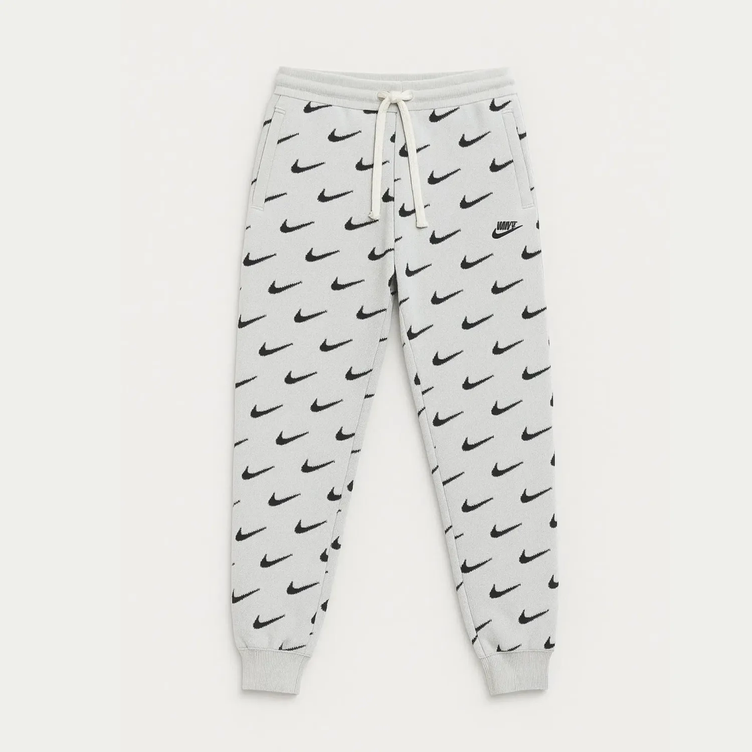 Nike sweatpants logo all over kids