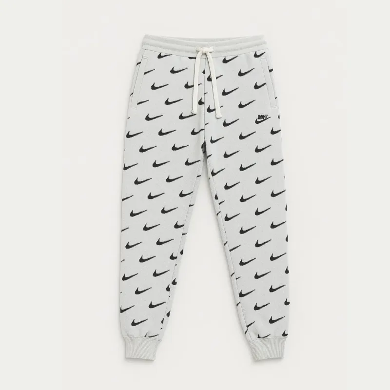 Nike sweatpants logo all over kids
