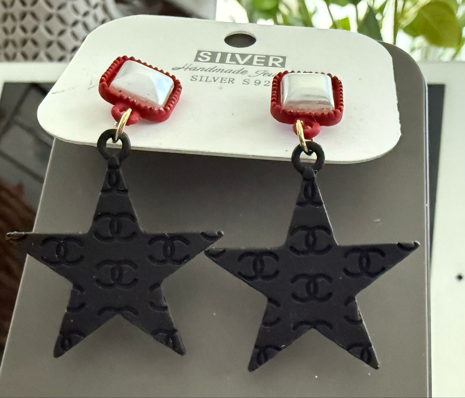 CC Black Dangling Star Earrings